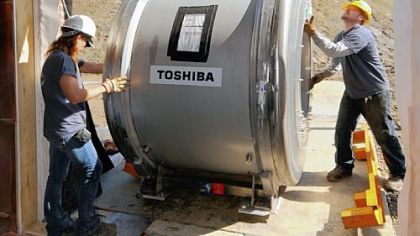 Workers for Benkart Rigging gently maneuver a seven-ton magnetic coil for a new magnetic resonance imaging machine at Jefferson Regional Medical Center's Diagnostic Services in Bethel Park in May 2010.