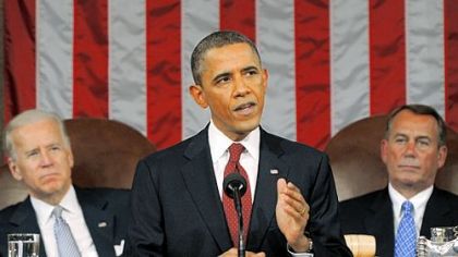 President Barack Obama delivers his State of the Union address on Capitol Hill in Washington. Listening in back are Vice President Joe Biden and House Speaker John Boehner, right.