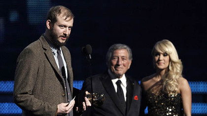 Justin Vernon of the band Bon Iver accepts the award for best new artist during the 54th annual Grammy Awards.