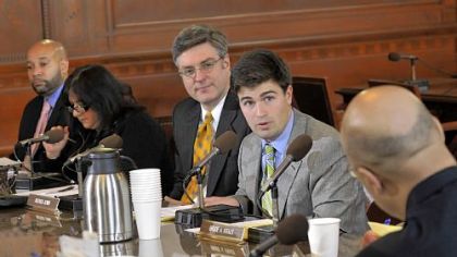 Pittsburgh City Councilman Corey O'Connor, second from right, responds to a question from Councilman Ricky Burgess, right, about the bill Mr. O'Connor was sponsoring with Bill Peduto to establish a program to offer assessment appeal services. Listening are council members, from left, R. Daniel Lavelle, Theresa Kail-Smith and Patrick Dowd.