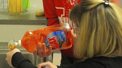 Karin Thum receives help in the kitchen from her fiance John Fitzgerald. They both rely on ACCESS for all of their transportation needs because of their disabilities.