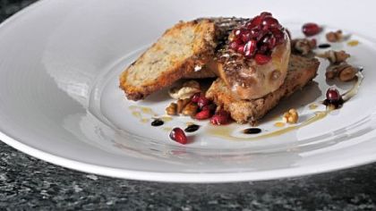 Sauteed foie gras with pomegranate seeds, hickory nuts and parsnip bread, dressed with balsamic vinegar at Eleven. The Strip District restaurant's executive chef Derek Stevens decided to keep foie gras on the menu after visiting its producer and observing the feeding process.