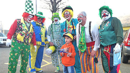 Four-year-old Caiden Smith was introduced to some fashion-forward clowns accessorized for today's St. Patrick's Day parade, Downtown.