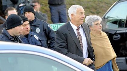 Jerry Sandusky arrives with his wife, Dottie, at the Centre County Courthouse in Bellefonte on Dec. 13.