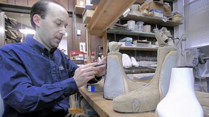 Marc Rosen works on custom shoes at his family's Best-Made Shoes.