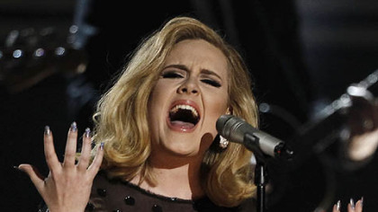 Adele performs "Rolling in the Deep" during the 54th annual Grammy Awards on Sunday. She took home six awards, including Record and Album of the Year.