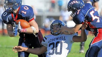 Shaler's J.P. Holtz, left. returns an interception for a touchdown to put a game away against Erie McDowell in October.