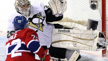 Montreal Canadiens right wing Erik Cole has his shot stopped by Penguins goalie Marc-Andre Fleury during the second period tonight's game in Montreal.