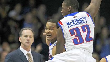 Pitt coach Jamie Dixon can only watch as DePaul's Brandon Young and Charles McKinney celebrate Thursday night at Allstate Arena.
