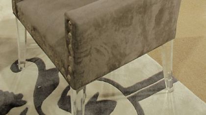 Light brown suede chair with crystal buttons and acrylic legs.
