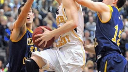 North Allegheny's JC Howard drives to the net Friday against Central Catholic's Sam Calhoun, left, and Mike Anselmo in the first half.