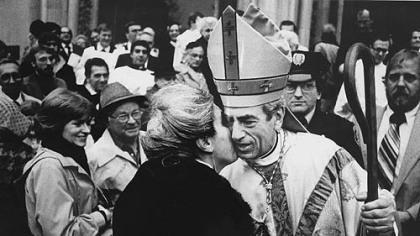 One of his flock kisses the cheek of newly installed Bishop Anthony Bevilacqua outside St. Paul's Cathedral in 1983.