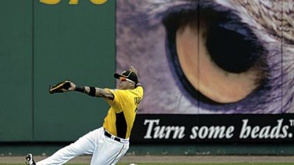 Right fielder Jose Tabata makes a sliding catch of a ball hit by Boston's Ryan Lavarnway Wednesday in Bradenton, Fla.