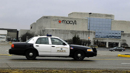 A Ross police crusier patrols the permitter of Ross Park Mall after an employee found a bomb threat written inside on a restroom wall.