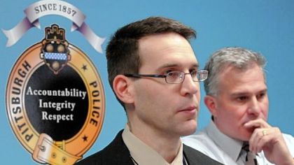 Pittsburgh police Cmdr. Thomas Stangrecki, left, and Allegheny County District Attorney Stephen A. Zappala Jr. answer questions about Tuesday's armored car robbery and what they described as the calculated killing of one of the crew.