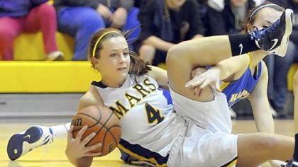 Mars Area High School's Teresa Dallatore grabs a loose ball in a game against Hampton.
