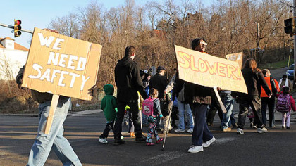 Two dozen people picketed the intersection of Second and Glenwood avenues in Hazelwood to protest speeding traffic where children wait for and board school buses.