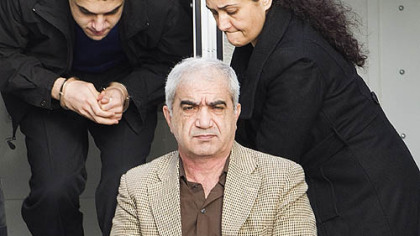 Mohammad Shafia, front, Tooba Yahya, right, and their son, Hamed Shafia, are escorted at the Frontenac County courthouse in Kingston, Ontario, Canada.