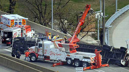 Truck overturns, snarling Parkway West traffic