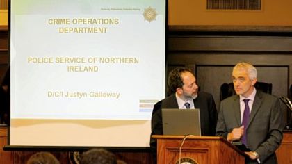 Cybergenetics' Mark W. Perlin, left, and Belfast Detective Chief Inspector Justyn Galloway talk about advanced DNA technology Friday at the Allegheny County Courthouse.