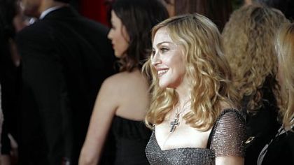 Madonna wore in a jade and metallic Reem Acra.