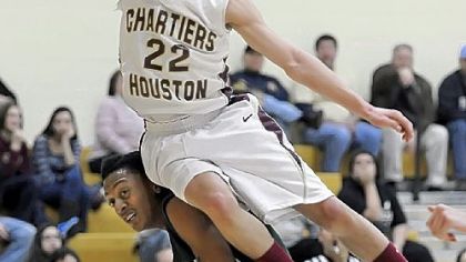 Chartiers-Houston's Shayne Murphy goes over top of Sto-Rox's Randy Hutchinson Tuesday in a WPIAL Class AA Section 5 game.