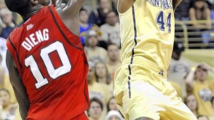 J.J. Moore tries to get up a shot in the first half.