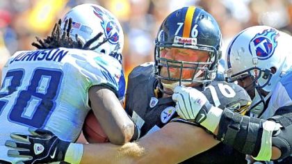 Chris Hoke makes a tackle on Tennessee's Chris Johnson earlier this season.