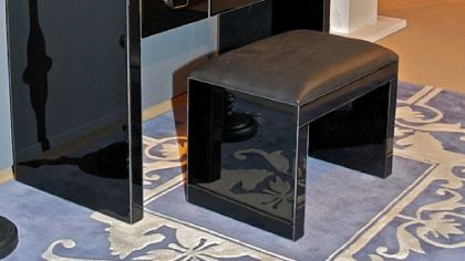 Black vanity, mirror and accessories from the Priscilla Presley Home