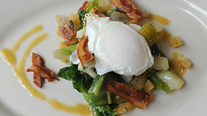 Escarole salad with poached egg and pickled veggies.