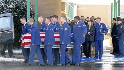 U.S. Air Force pallbearers leave Harbor Creek High School Monday carrying the casket of Air Force Senior Airman Bryan R. Bell, of Harborcreek Township, near Erie, Pa., after a funeral service. Airman Bell, 23, was one of three airmen killed Jan. 5 in Afghanistan by an improvised explosive device.