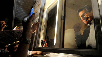 Joe Paterno acknowledges supporters gathered outside his house on Nov. 8 as the Penn State board pondered his fate.