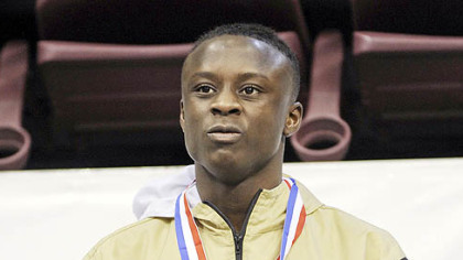Brashear's Godwin Nyama recieves his first place medal  in the 120 pound AAA Final match.