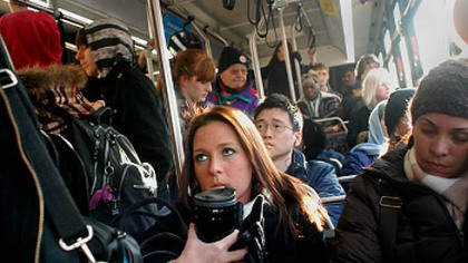 One of the Port Authority's many crowded buses, their own little mini-societies.
