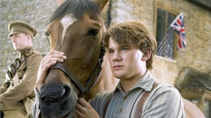 Jeremy Irvine as Albert and one of the 14 horses that were used as Joey in "War Horse."