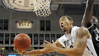 Pitt's Cameron Wright drives to the basket against Providence's Ron Giplaye in the first half Wednesday of what would become the Panthers' first Big East win of the season -- 86-74 vs. Providence at Petersen Events Center.