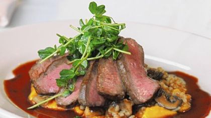 Flat Iron Steak and Red Wine sauce with Barley-Mushroom Risotto and Carrot Puree, from Legume Bistro in Oakland.