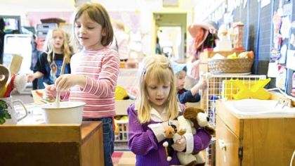 Pre-K students Sophia Powell, left, and Sophia Weiss were thoroughly entertained at Holy Child Catholic School's open house and science fair Sunday.