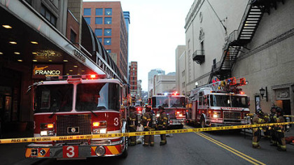 Firefighters respond to a fire on the ninth floor of the Roosevelt Arms building on Penn Avenue in Downtown Pittsburgh.