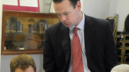Mayor Luke Ravenstahl, center, and attorney Michael Stetor listen while Bill Tyhurst, right, describes the photos of his property. Mr. Tyhurst said the assessed value on his home went from $39,900 to $128,100.