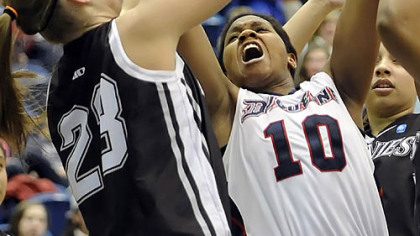 Duquesne's Wumi Agunbiade grabs a rebound against St. Bonaventure's Megan Van Tatenhove Wednesday. St. Bonaventure held on for a 58-53 win at Palumbo Center.