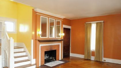 The living room features one of the house's three fireplaces.