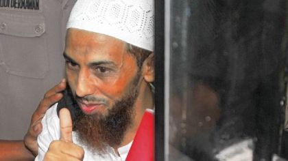 Indonesian terror suspect Umar Patek gestures after his trial in West Jakarta court in Jakarta on Tuesday.