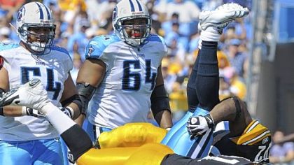 Steelers Aaron Smith stands Titans quarterback Vince Young on his head in a 2010 game.