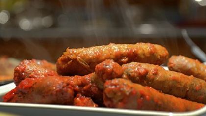 Cooked Italian sausage, prepared by Karen Panella as part of a meal following preparation of sopressata.