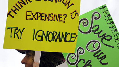 Stacy Bodow from Friendship listens to speakers at the Yinzer Nation Rally to protest Governor Tom Corbett's education budget held today at Schenley Park Plaza.