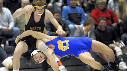 North Allegheny's Blynn Shideler tries to get away from Canon-McMillan's Conner Schram during the 120-pound weight class match at the WPIAL Class AAA team tournament final Saturday at Chartiers Valley High School. The Big Macs won the title.