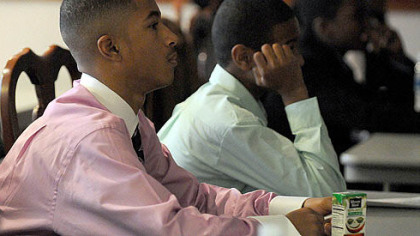 David Harris, 14, of Wilkinsburg listens to a classmate's presentation during the Gateway Medical Society medical mentoring program for youths in December.