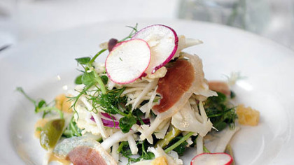Kohlrabi and cauliflower salad with four swiss maiden cheese.