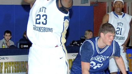 David Palmer, left, a Westinghouse High School graduate, leads the Allegheny Mountain Collegiate Conference in rebounding and has twice pulled down 20 rebounds in a game this season.